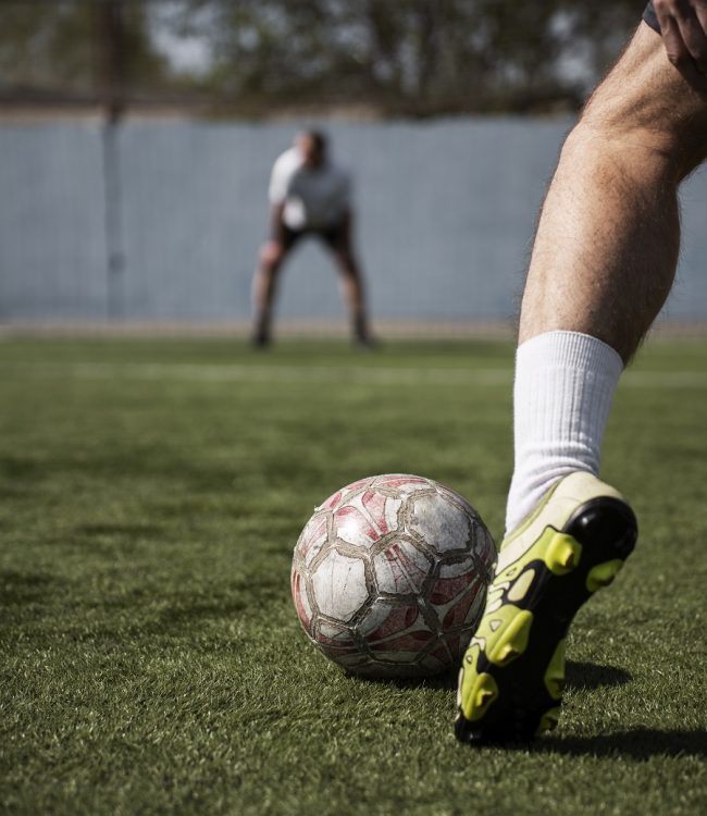 side-view-man-playing-soccer